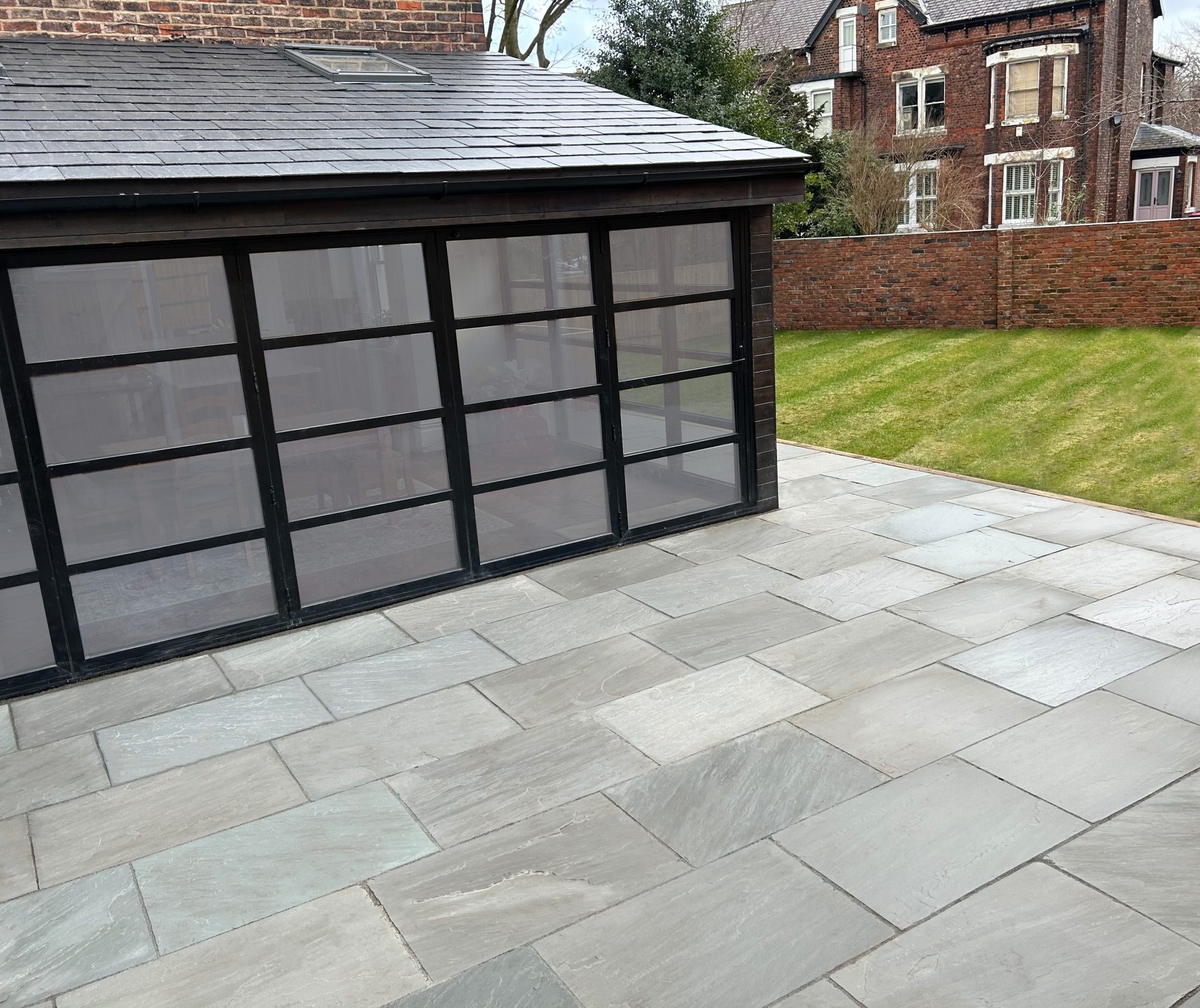 This picture shows Kandla Grey 900x600 Indian Sandstone Paving